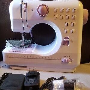 Compact White and Pink Sewing Machine